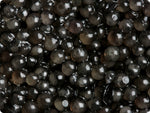 Close-up shot filled with the black gelatinous balls of Beluga Caviar.