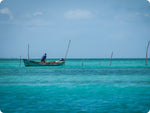 local fisherman in small boat in central america