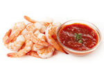 Cooked Tiger Prawns with tails-on served with a homemade organic cocktail sauce. 